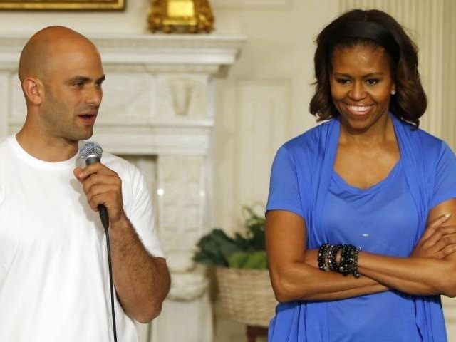 First lady Michelle Obama stands with White House Senior Policy Adviser for Nutrition Poli