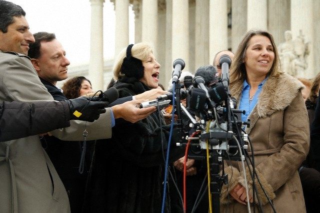 Peggy Young talks to reporters as she departs the U.S. Supreme Court building in Washington