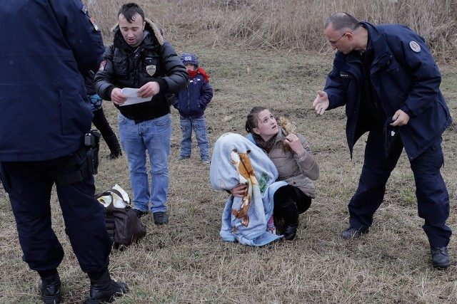 Serb Police challenge Kosovan immigrants on Hungarian border.