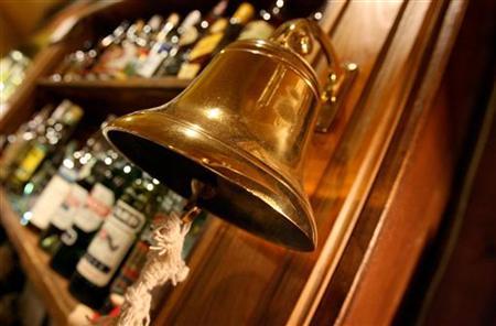 A traditional "last orders" bell is seen behind the bar at The Speaker pub in Victoria cen