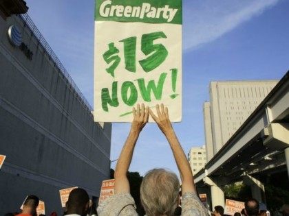 Protesters march in support of raising the minimum wage to $15 an hour as part of an expan