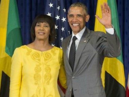 President Barack Obama poses with Jamaican Prime Minister Portia Simpson Miller prior to their bilateral meeting at the Jamaica House, Thursday, April 9, 2015 in Kingston, Jamaica.