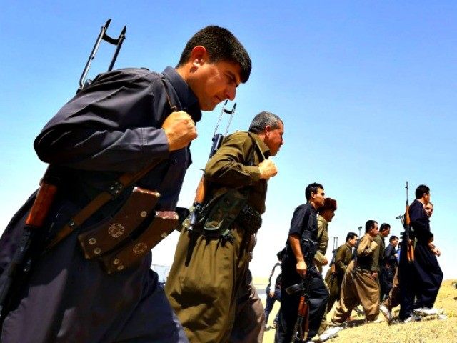 Kurdish Peshmerga Forces Stand Guard Near Mosul