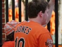 Orioles Fan Watching Behind the Fence Orioles Fan Watching Behind the Fence