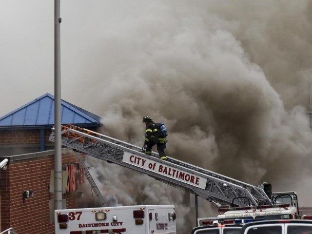Firefigthers respond to a fire at a CVS pharmacy on Pennsylvania Avenue in Baltimore