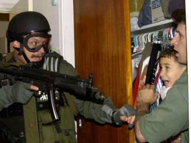 The international fight over where Gonzalez would live ended with him returning to Cuba. In this picture, armed federal agents seized Elian Gonzalez from the home of his Miami relatives before dawn, firing tear gas into an angry crowd as they left the scene with the weeping 6-year-old boy.