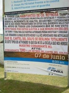 A narco banner set up by the Gulf Cartel asking the public to report petty crime