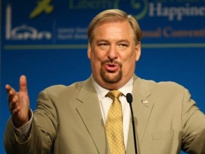 In this Saturday, July 4, 2009 file photo, evangelical pastor Rick Warren gestures as he s