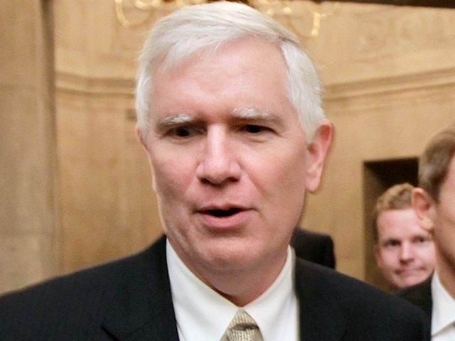 Rep. Mo Brooks, R-Ala., left, and Rep. Spencer Bachus, R-Ala., right, emerge from the Capitol office of House Speaker John Boehner, R-Ohio, as the scheduled vote on his debt plan bill is delayed in Washington, Thursday night, July 28, 2011.