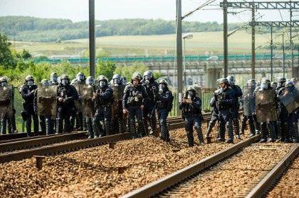 French riot police officers take position to drive out protesting French employees (unseen