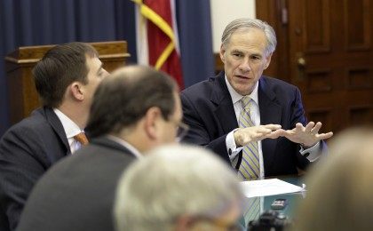 Texas Gov. Greg Abbott, right, talks with news reporters during a round table talk in his office at the Texas Capitol, Wednesday, June 3, 2015, in Austin, Texas. (AP Photo/Eric Gay)
