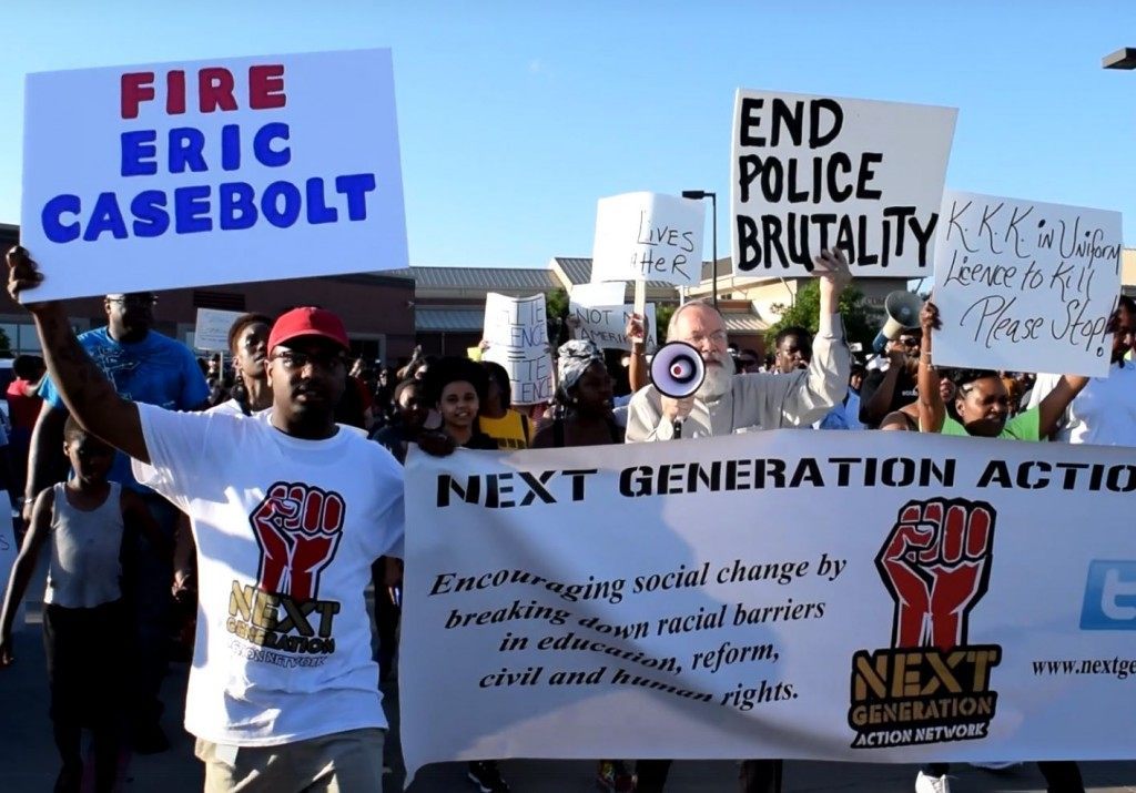 Protesters demand termination of Corporal Casebolt and call cops "KKK". (Photo: Breitbart Texas/Bob Price)