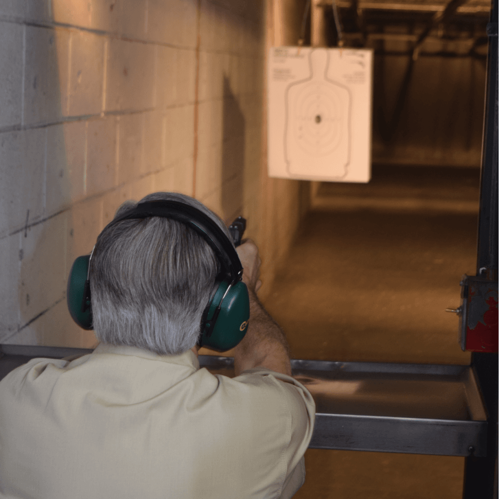 Governor Greg Abbott takes a few moments to fire off some rounds at Red's Indoor Gun Range in Pflugerville, Texas, in celebration of the Texas Open Carry Law. (Photo: Breitbart Texas/Bob Price)