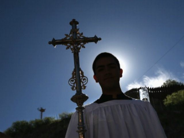 A Catholic procession begins a special 'Mass on the Border' along the U.S.-Mexico border fence on April 1, 2014 in Nogales, Arizona. Catholic bishops led by the Archbishop of Boston Cardinal Sean O'Malley held the mass to pray for comprehensive immigration reform and for those who have died along the …