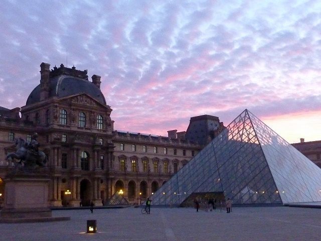 A picture shows the Louvre museum and th
