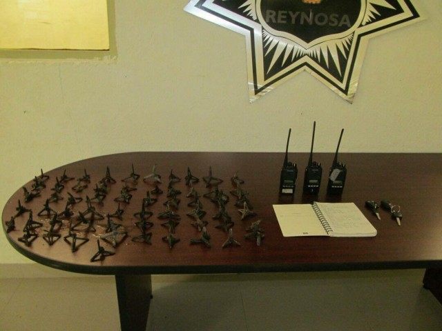 Various radios and tire spikes used by Gulf Cartel lookouts called hawks.