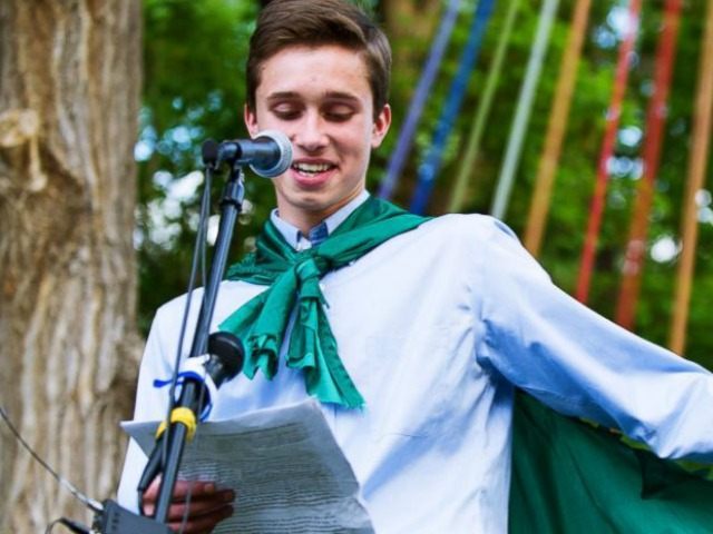 Twin Peak Charter School senior Evan Young reads his valedictorian speech on May 31, 2015