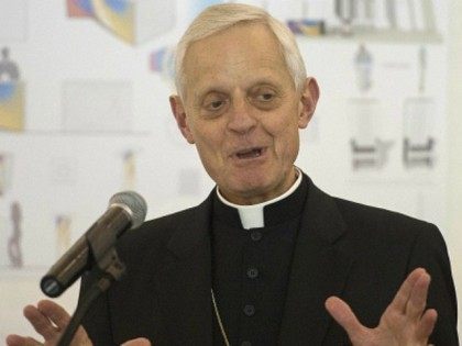 Cardinal Donald Wuerl, the Archbishop of Washington, speaks during the announcement of the winning design for the furnishings for Papal Mass at the Basilica of the National Shrine of the Immaculate Conception during Pope Francis' visit, on display at Catholic University's Miller Exhibition Hall in Washington, DC, June 2, 2015.