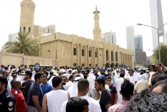Crowds surround the Imam Sadiq Mosque after a bomb explosion following Friday prayers, in