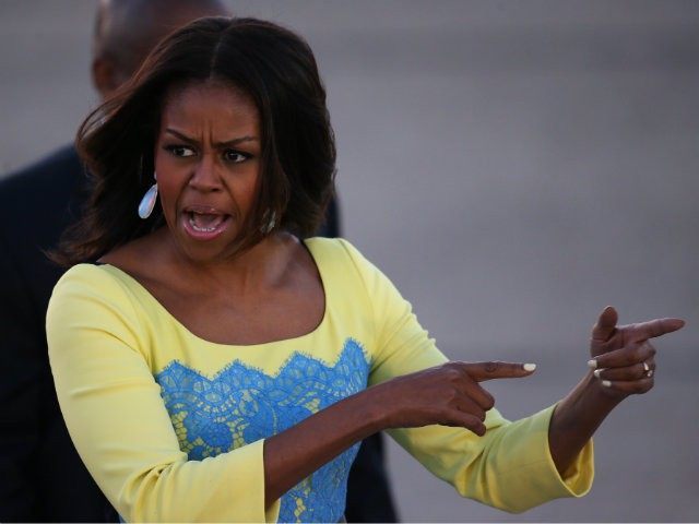 First Lady Michelle Obama arrives at Stanstead airport for a visit to London on June 15, 2