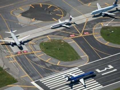 Airplanes wait to take off at LaGuardia Airport in New York.