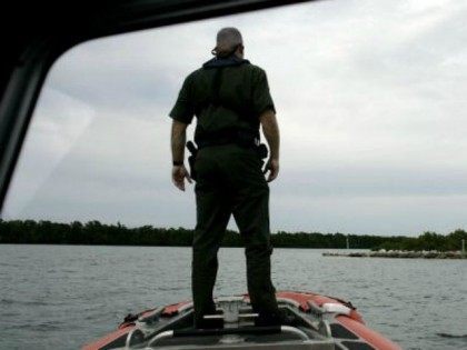 U.S. Border Patrol agent Dan Schaefer looks at a small island, where smugglers are known t