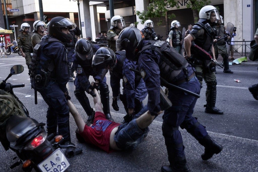 An anti-austerity demonstrator is arrested in Syntagma Square during an anti-Austerity rally on July 3, 2015 in Athens, Greece. Milos Bicanski/Getty Images