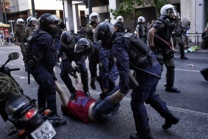 An anti-austerity demonstrator is arrested in Syntagma Square during an anti-Austerity ral