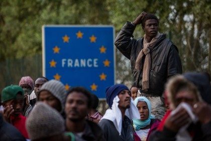 Migrants gather near the Eurotunnel terminal (Rob Stothard/Getty Images)