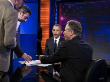 President Barack Obama and host Jon Stewart sit during a break in a live taping of the 'Daily Show with Jon Stewart' on October 18, 2012 in New York, New York. Obama is traveling to New Hampshire and New York to attend campaign events before appearing on the 'Daily Show' …