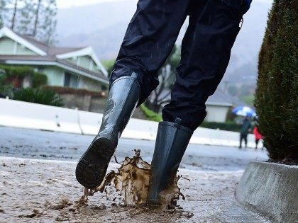 Rain boots puddles (Frederic J. Brown / AFP / Getty)