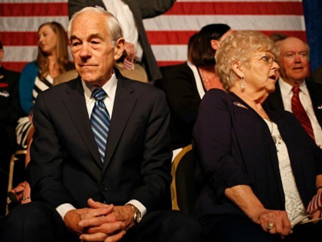 Rep. Ron Paul (R-TX) sits on stage before watching his son Sen. Rand Paul (R-KY) announce