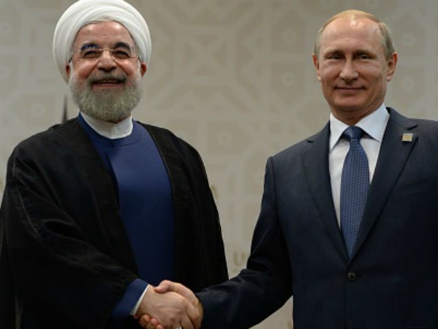 In this handout image supplied by Host Photo Agency / RIA Novosti, President of the Russian Federation Vladimir Putin (R) and President of the Islamic Republic of Iran Hassan Rouhani meet during the BRICS/SCO Summits - Russia 2015 on July 09, 2015 in Ufa, Russia.