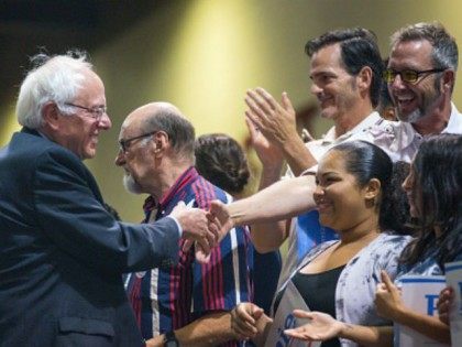 U.S. Sen. Bernie Sanders (I-VT) greets supporters during a rally at the Phoenix Convention Center July 18, 2015 in Phoenix, Arizona. The Democratic presidential candidate spoke on his central issues of income inequality, job creation, controlling climate change, quality affordable education and getting big money out of politics, to more …