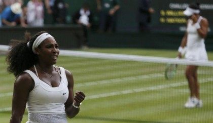 Serena Williams of the U.S.A. celebrates after winning her match against Heather Watson of Britain (R) at the Wimbledon Tennis Championships in London