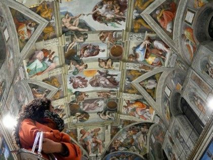 Journalists stare at the Sisitne Chapel with its new lighting during a press visit at the