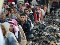 Syrian-refugees-sitting-reuters Reuters