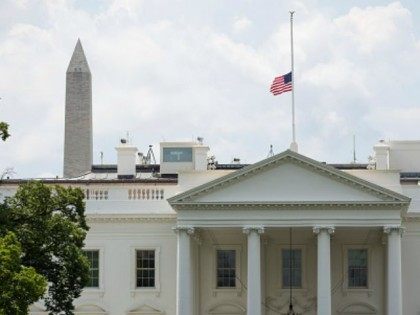 A flag atop White House flies at half-staff in honor of Beau Biden, on June 6, 2015, in Washington, DC. President Obama is traveling to Wilmington, Delaware to deliver a eulogy for Beau Biden the son of Vice President Joe Biden after he died at 46 following a two-year battle …