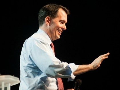 Scott Walker waves during the Western Conservative Summit at the Colorado Convention Center in Denver, Colorado on June 27, 2015 in Denver, Colorado. The Western Conservative Summit attracts thousands of conservatives and a number of prominent politicians; this year the lineup includes Rick Santorum, Mike Huckabee, Carly Fiorina, Ben Carson, …