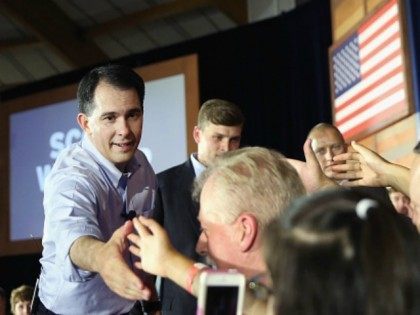 Wisconsin Governor Scott Walker greets supporters after announcing that he will seek the Republican nomination for president on July 13, 2015 in Waukesha, Wisconsin. Walker is the 15th candidate to formally announce intentions to seek the Republican nomination. (Photo by