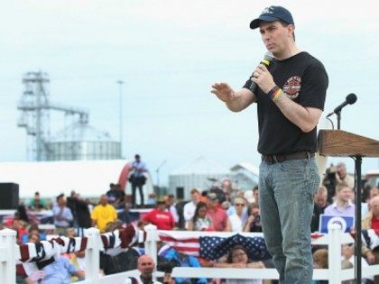 Republican presidential hopeful Wisconsin governor Scott Walker speaks at a Roast and Ride event hosted by freshman Senator Joni Ernst (R-IA) on June 6, 2015 in Boone, Iowa. Ernst is hoping the event, which featured a motorcycle tour, a pig roast, and speeches from several 2016 presidential hopefuls, becomes an …