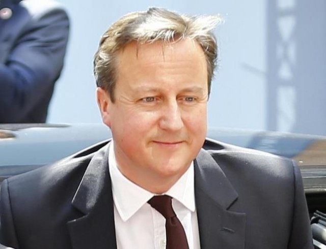 British Prime Minister Cameron arrives at EU Council headquarters for EU leaders summit in