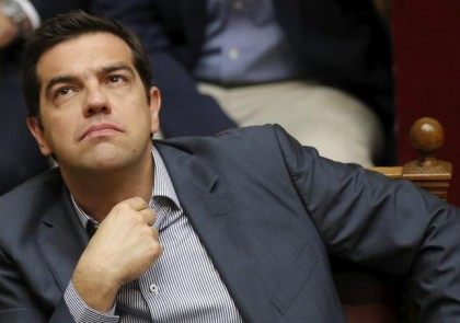 Greek Prime Minister Alexis Tsipras reacts during a voting session at the Parliament in At