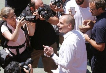 Greek Finance Minister Yanis Varoufakis leaves a polling booth after casting his ballot at