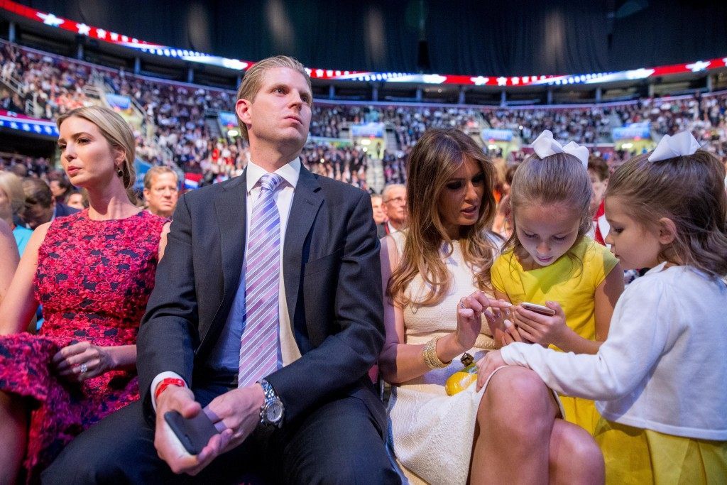 The daughters of Republican presidential candidate Sen. Ted Cruz, R-Texas, Catherine, 4, right, and Caroline, 7, center, visit with Donald Trump's wife Melania Trump, third from right, accompanied by Donald Trump's children Ivanka Trump, left, and Eric Trump, second from left, during a commercial break in the first Republican presidential debate at the Quicken Loans Arena, Thursday, Aug. 6, 2015,  in Cleveland. (AP Photo/Andrew Harnik)