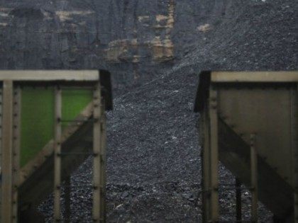 Coal harvested from a strip mine sits behind a pair of coupled coal cars on the grounds of Blackhawk Mining, LLC Spurlock Prep Plant on June 3, 2014 in Printer, Kentucky. New regulations on carbon emissions proposed by the Obama administration have reportedly angered politicians on both sides of the …