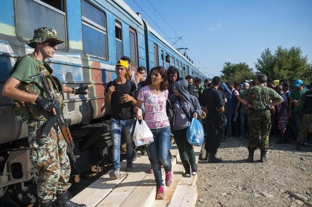 Migrants board a train to Serbia in the new reception center near the town of Gevgelija. (