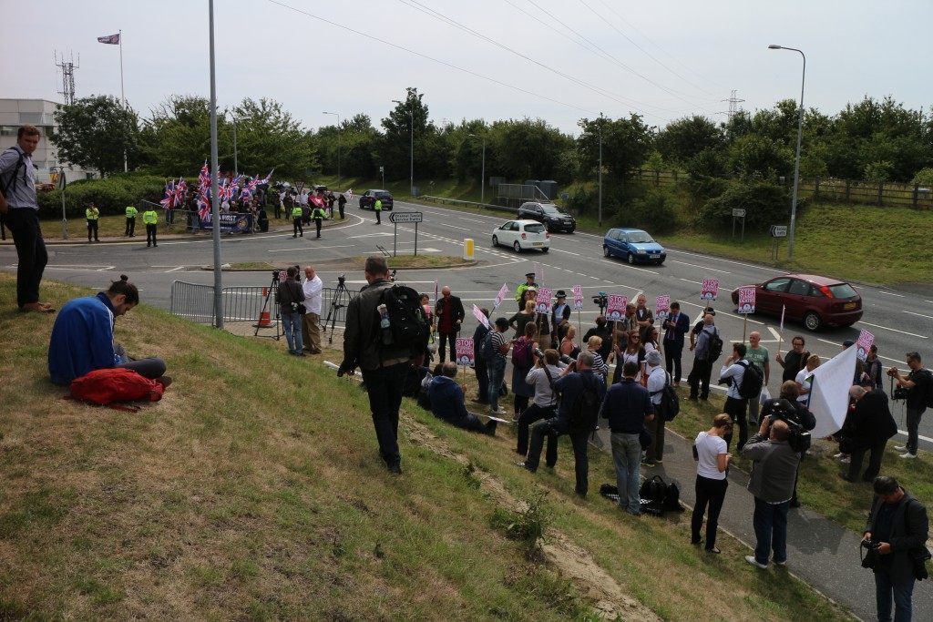 Rival protesters face off across the road