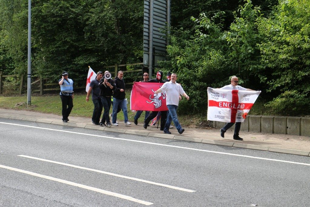 An EDL counter-demonstration marches alongside