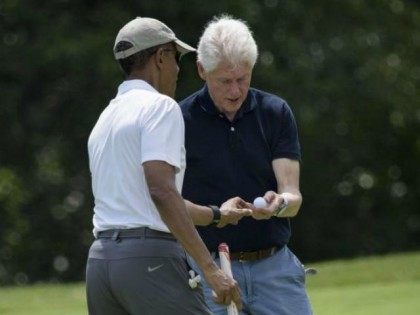 Obama-Clinton-golf-AFP